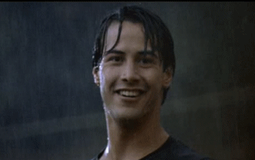 Una GIF di Keanu Reeves sotto la pioggia
