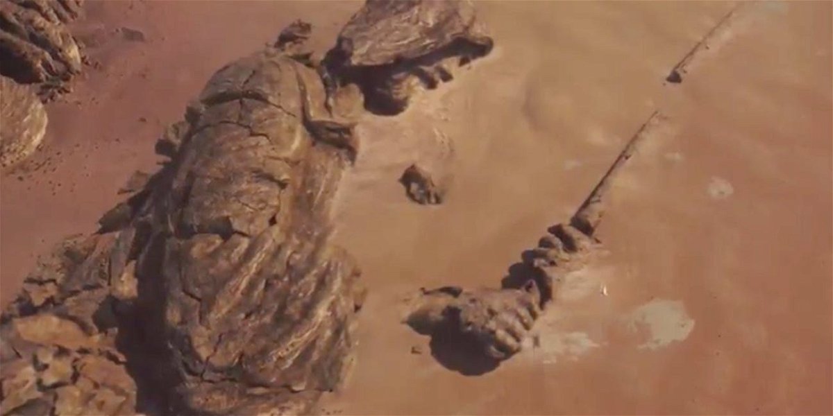 Una statua Jedi immersa nel terreno 