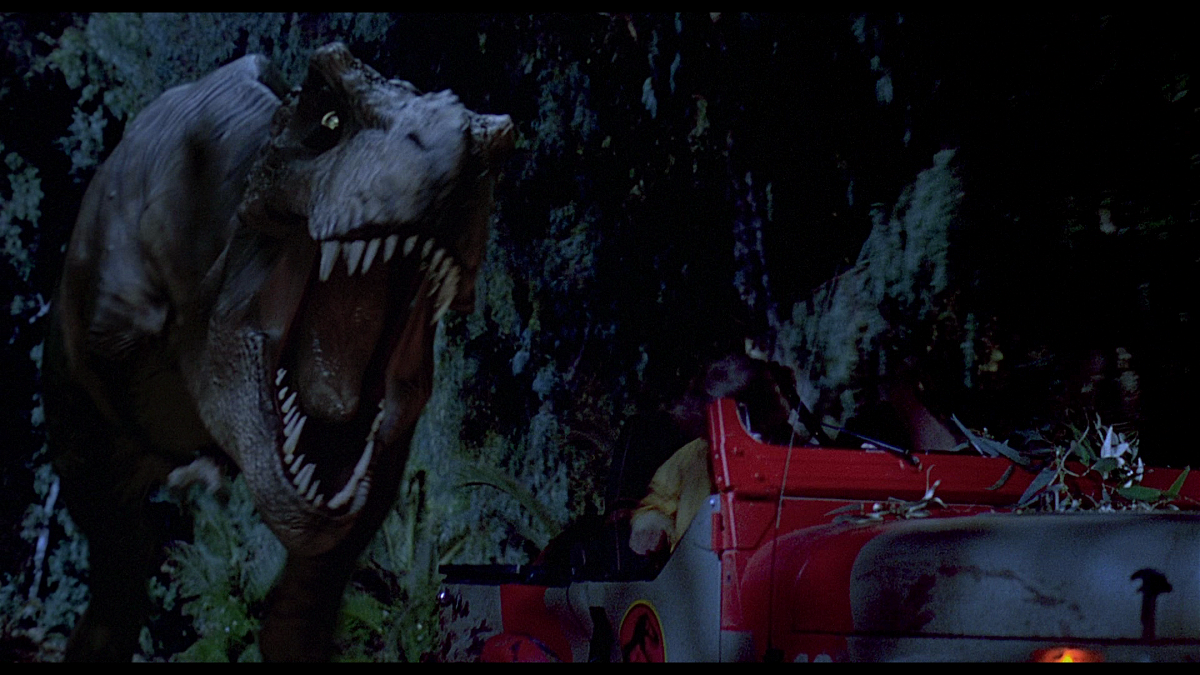 Il T-Rex rincorre la jeep in una delle scene più celebri di Jurassic Park