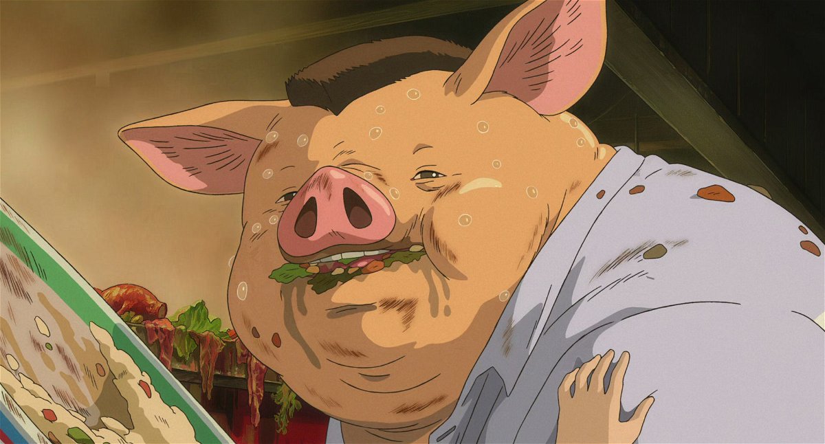 Il padre di Chihiro trasformato in maiale dopo aver mangiato il cibo della città incantata