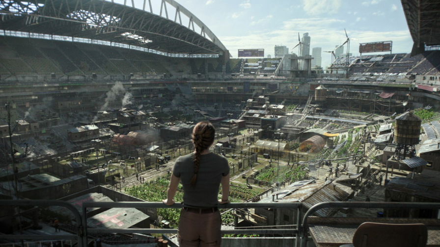 The Last of Us - Abby guarda dalla finestra la base dei W.L.F. in cui si trova